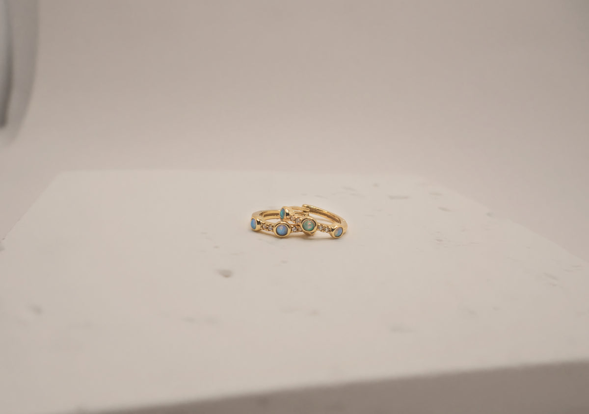 The Aura Pavé & Opal Huggies